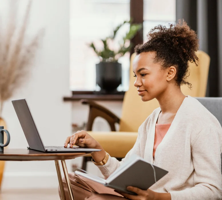 A professional working on a laptop